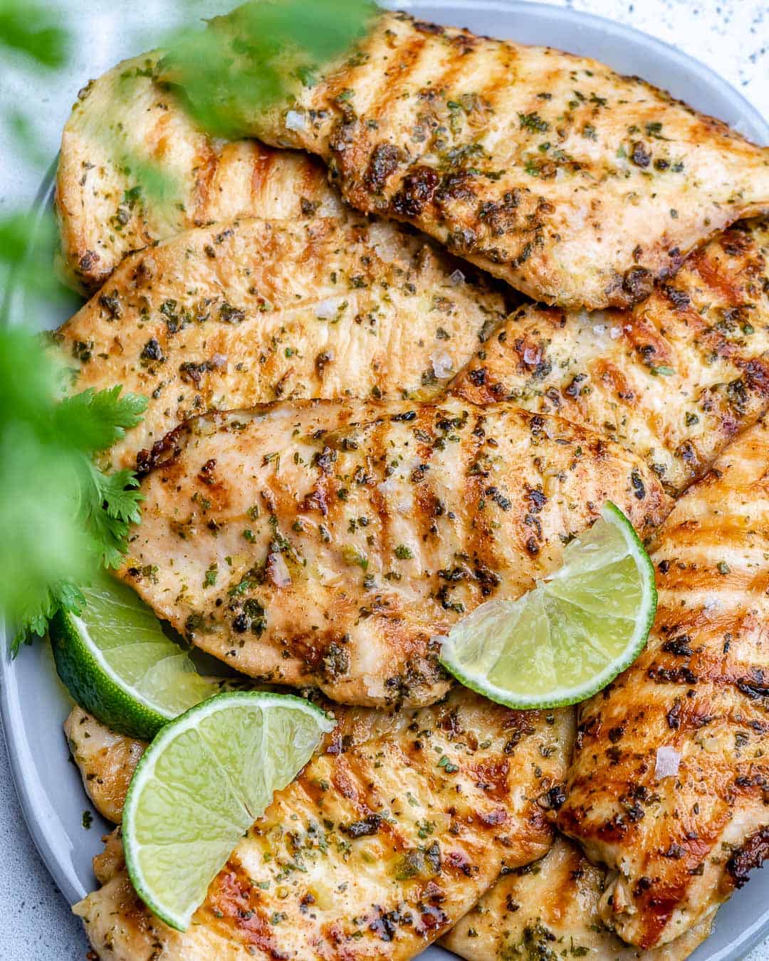 cilantro lime grilled chicken on a serving tray with lettuce.