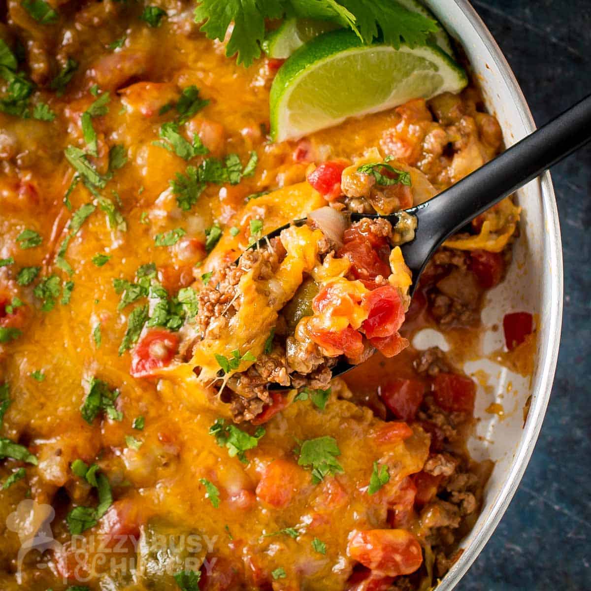 taco skillet dinner with spoon dishing out serving.