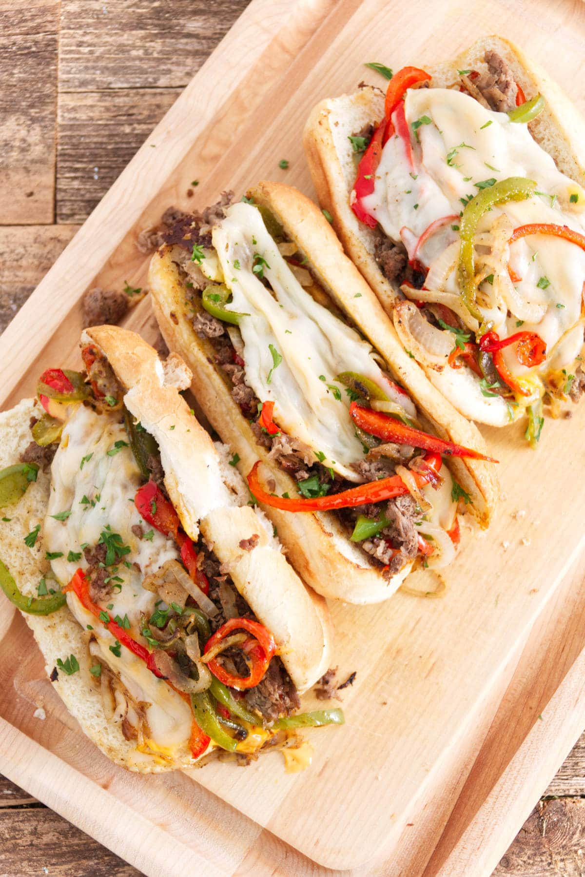 blackstone philly cheesesteak rolls on a serving tray.