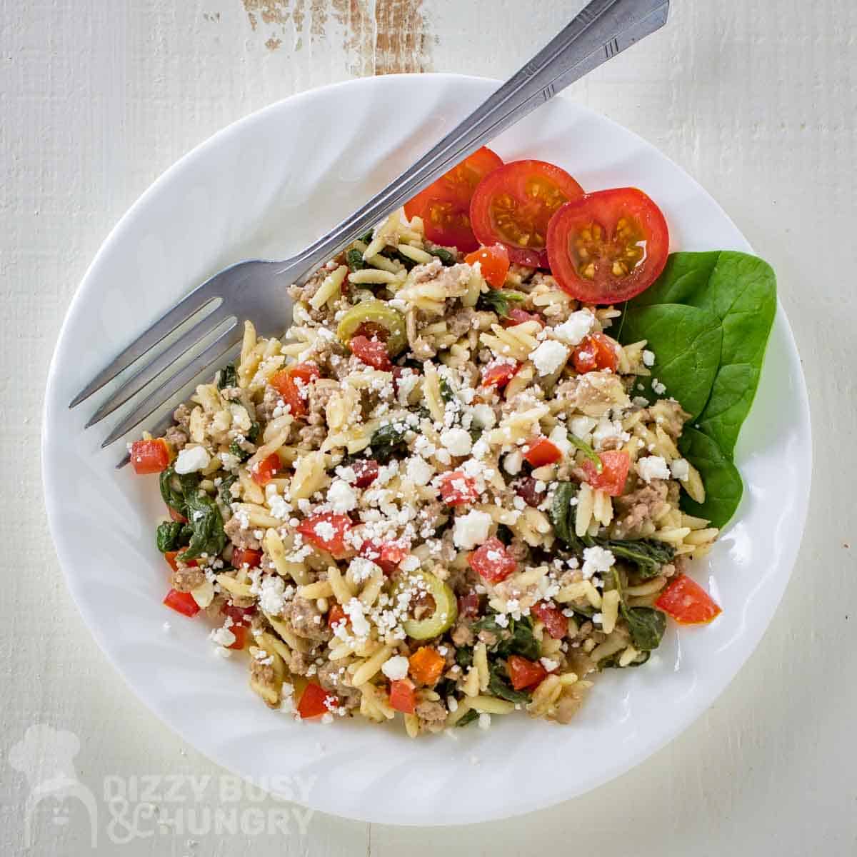white bowl with ground beef and orzo pasta.