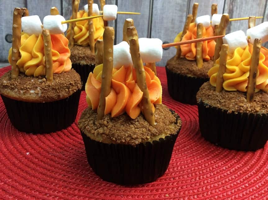 campfire cupcakes with orange icing and pretzels.