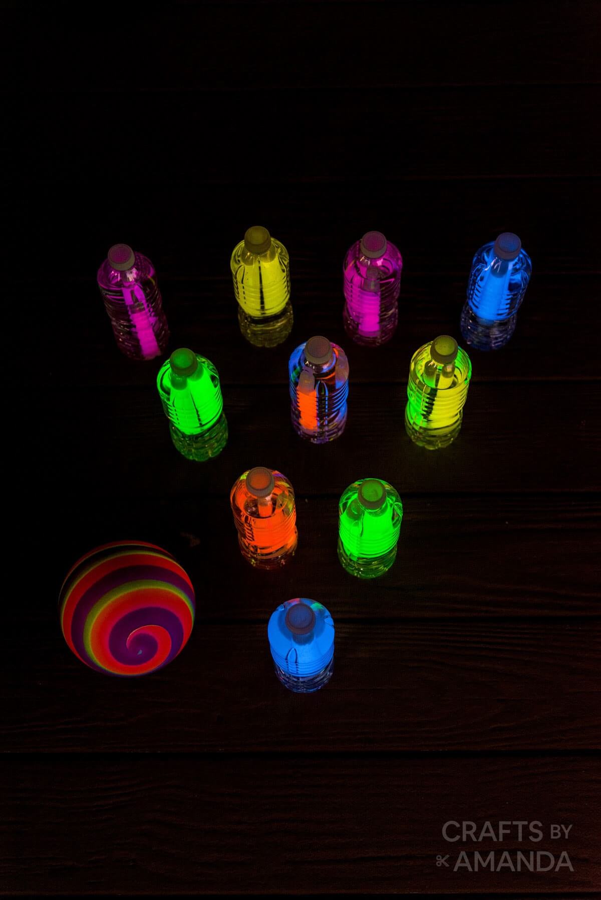 glow in the dark bowling with glow sticks in bottles.