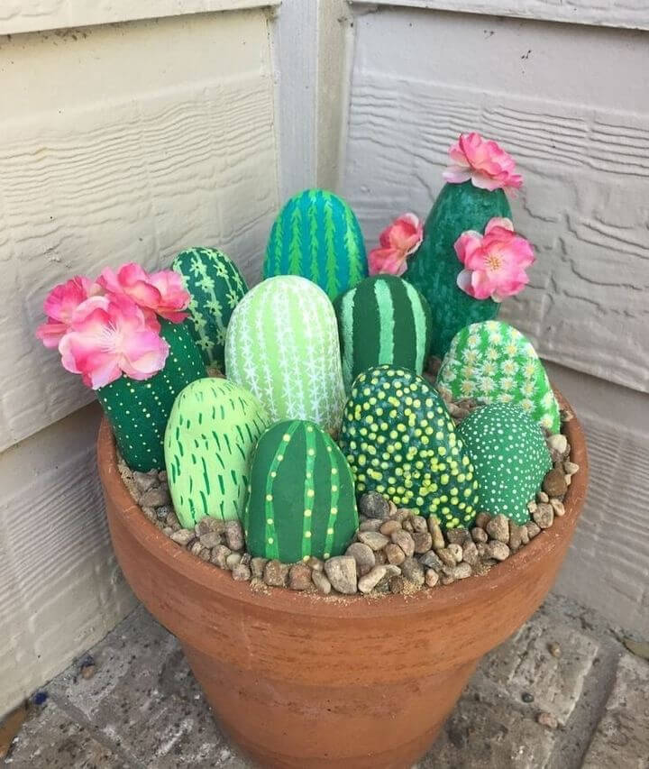 painted rock cactus in pot plant.